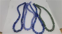 4 strings of glass beads