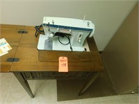 Lot 178  Singer Sewing Machine and Cabinet.