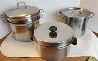 Large cooking pots, one steamer