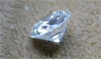 Loose 1/2 carat diamond, lighting gives blue look