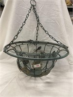 Metal hanging basket with flowers