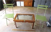 Glass top stand and 2 green folding chairs