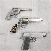 Three vintage metal toy guns