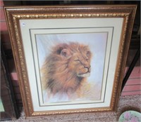 Framed and matted print of a lion. Signed: Ruane
