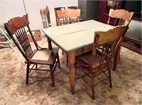 Antique wooden table with 4 pressed back chairs
