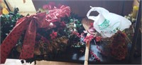 Christmas decor including wreaths, metal sleigh