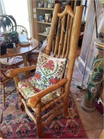 Primitive pine wood armchair with leather seat
