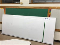 White board approximately 9’ long