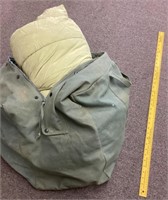 Sleeping bag in canvas duffel