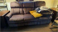 Three person sofa with three blankets and two