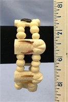 Approx. 8" ivory and bone bead bracelet, walrus iv