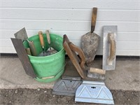 Green pail with trowels