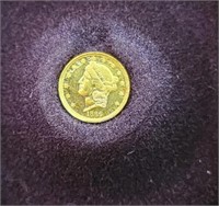 Miniature gold replica coin