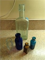 Collection of five vintage glass bottles