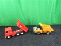 2 toy dump trucks