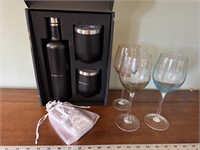 Colored wine glasses wine cooler bottle and cork