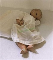 Antique doll in need of restoration measuring