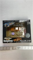 American muscle body shop police car 1/54 scale