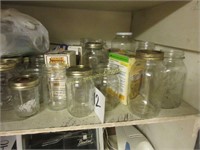 full shelf of jars, tins, and vases