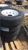 Four Unused Tires - ST235/80R16 With Rims
