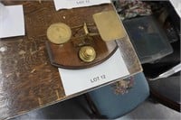 antique brass balance scale on wood base
