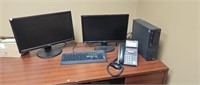 2 monitors a keyboard and a computer without a