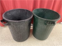 Two plastic garbage cans. No lids.