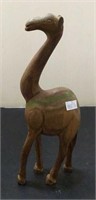 Carved giraffe of wood measuring 9 1/2 inches