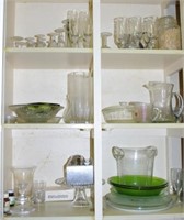 One shelf and two cupboards of vintage glass ware