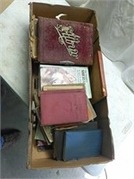 Box of old books and newspapers