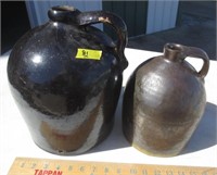 2 jugs, big one has a crack