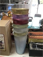 STACK OF METAL CUPS
