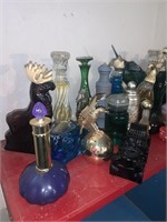 Large collection of Avon decanter bottles