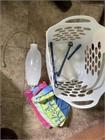 laundry basket with towels, calf drenchers
