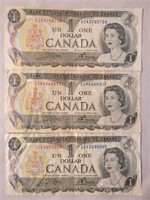 Three Canadian One Dollar Bills