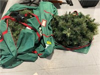GROUP OF ARTIFICIAL CHRISTMAS TREES IN STORAGE