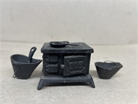 Miniature cast-iron stove with coal buckets