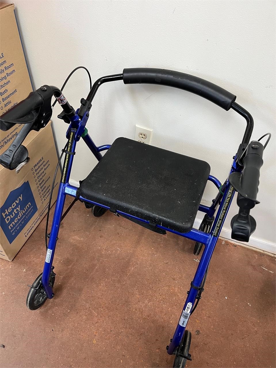 Four wheeled walker/seat