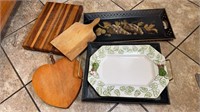 Three wood cutting boards, two metal serving