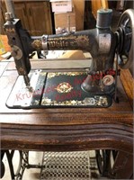 Antique white pedal sewing machine