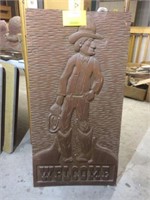 carved "WELCOME" sign
