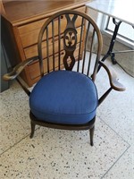 Vintage wooden petite chair with armrests.