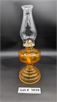 LARGE ANTIQUE OIL LAMP WITH A BOTTLE OF LAMP OIL