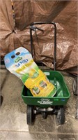 SCOTTS SEED SPREADER W/ WEED AND FEED