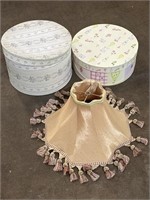 Two hat boxes and decorative lamp shade