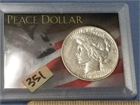 Peace silver dollar 1927 in plastic display holder