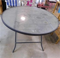 Metal framed glass top patio table, 40" x 28"