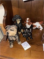 4 dog statues