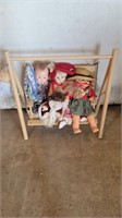 Wooden swing with dolls