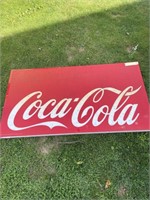 Large plastic Coca-Cola sign